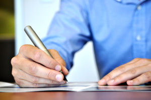 Man writing search engine optimised copy for his website